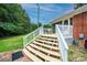 Steps leading up to a wooden deck with white railings at 2501 Twin Ave, Gastonia, NC 28052