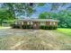 Brick ranch house with landscaped yard and driveway at 2501 Twin Ave, Gastonia, NC 28052