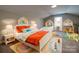 Bright bedroom with two beds, built-in shelves, and playful decor at 9403 E Nc 218 Hwy, Peachland, NC 28133