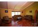 Living room with hardwood floors, vaulted ceiling and two comfy sofas at 44097 Nc 740 Hwy, New London, NC 28127