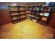 Basement storage area with shelving units for ample storage at 44097 Nc 740 Hwy, New London, NC 28127