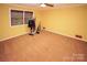 Well-lit bedroom with carpeted floor and ample closet space at 44097 Nc 740 Hwy, New London, NC 28127