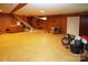Unfinished basement with wood paneling, ample storage, and stairs at 44097 Nc 740 Hwy, New London, NC 28127
