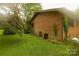 Brick house exterior showcasing a side view and landscaping at 44097 Nc 740 Hwy, New London, NC 28127