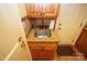 Small kitchen sink with granite countertop and wood cabinets at 44097 Nc 740 Hwy, New London, NC 28127