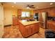 Large kitchen with an island, granite counters, and stainless steel appliances at 44097 Nc 740 Hwy, New London, NC 28127