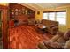 Living room boasts hardwood floors, a brick fireplace and lots of natural light at 44097 Nc 740 Hwy, New London, NC 28127