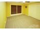 Bright bedroom with carpeted floor, double closet, and window with blinds at 44097 Nc 740 Hwy, New London, NC 28127