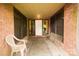 Brick front porch with a stone floor and seating area at 44097 Nc 740 Hwy, New London, NC 28127