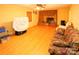 Spacious living room with hardwood floors and a brick fireplace at 44097 Nc 740 Hwy, New London, NC 28127