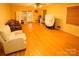 Bright living room featuring hardwood floors and access to backyard at 44097 Nc 740 Hwy, New London, NC 28127