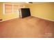 Spacious carpeted bedroom with neutral walls and large windows at 44097 Nc 740 Hwy, New London, NC 28127