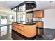 Unique curved kitchen island with granite countertops and stainless steel appliances at 3245 Jackson Rd, Mooresville, NC 28115