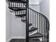 Black metal spiral staircase with dark treads at 3245 Jackson Rd, Mooresville, NC 28115