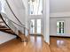 Grand entryway with a curved staircase and double doors at 3245 Jackson Rd, Mooresville, NC 28115