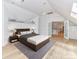 Bright bedroom with a king-size bed, hardwood floors, and access to a hallway at 3245 Jackson Rd, Mooresville, NC 28115