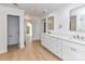 Modern bathroom with double vanity, a walk-in shower, and hardwood floors at 3245 Jackson Rd, Mooresville, NC 28115