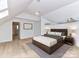 Spacious bedroom with a king-size bed and hardwood floors at 3245 Jackson Rd, Mooresville, NC 28115