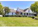 Stunning white two-story home with landscaped lawn and driveway at 3245 Jackson Rd, Mooresville, NC 28115