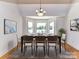 Spacious dining room with bay window, hardwood floors, and a formal dining setting at 3245 Jackson Rd, Mooresville, NC 28115