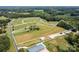 Aerial view showing a large lot with a home and outbuildings at 3245 Jackson Rd, Mooresville, NC 28115