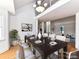 Bright dining room with a large table, hardwood floors, and access to the living room at 3245 Jackson Rd, Mooresville, NC 28115