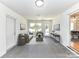 Sunroom features tiled floors, comfortable seating, and access to the backyard at 3245 Jackson Rd, Mooresville, NC 28115
