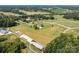 Aerial view of property showing home, surrounding land, and nearby buildings at 3245 Jackson Rd, Mooresville, NC 28115