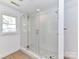 Clean bathroom with a large walk-in shower and penny tile floor at 3245 Jackson Rd, Mooresville, NC 28115