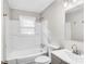 Clean bathroom with a bathtub, toilet and vanity at 711 Gallagher St, Charlotte, NC 28208