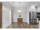 Bright dining area with hardwood floors and modern light fixture at 3738 Yorkshire Pl, Terrell, NC 28682