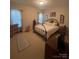 Spacious bedroom with a metal bed frame and large windows at 1376 21St Ne Ave, Hickory, NC 28601