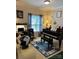 Bright music room featuring a grand piano, comfortable seating, and natural light at 1376 21St Ne Ave, Hickory, NC 28601