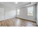 Empty bedroom with light gray walls and wood-style flooring at 106 N Dunlavin Way # 4, Mooresville, NC 28115