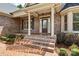 Elegant front entrance with brick steps and columns at 2504 Stoneview Ct, Denver, NC 28037