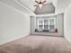 Main bedroom with a window seat and tray ceiling at 2504 Stoneview Ct, Denver, NC 28037