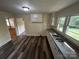 Kitchen with white cabinets, vinyl flooring, and a double sink at 201 Institute St # 1, Salisbury, NC 28144