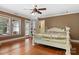 Bright bedroom with hardwood floors, ceiling fan, and access to deck at 1099 4Th Avenue Nw Dr, Hickory, NC 28601