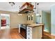 Eat-in kitchen with island, stainless steel appliances, and hardwood floors at 1099 4Th Avenue Nw Dr, Hickory, NC 28601