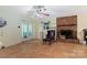 Basement recreation area with a brick fireplace and tiled floor at 1099 4Th Avenue Nw Dr, Hickory, NC 28601