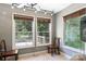 Cozy bedroom with hardwood floors, ceiling fan, and large windows at 1099 4Th Avenue Nw Dr, Hickory, NC 28601