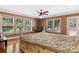 Bright bedroom with wood floors, a ceiling fan, and access to a private balcony at 1099 4Th Avenue Nw Dr, Hickory, NC 28601