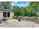 Wooden deck with table and chairs overlooking backyard at 1099 4Th Avenue Nw Dr, Hickory, NC 28601