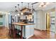 Spacious kitchen with island, stainless steel appliances, and hardwood floors at 1099 4Th Avenue Nw Dr, Hickory, NC 28601