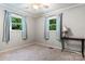 Bedroom with carpet, ceiling fan, and two windows with curtains at 1099 4Th Avenue Nw Dr, Hickory, NC 28601