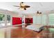 Spacious main bedroom with hardwood floors, double ceiling fans, and access to a deck at 1099 4Th Avenue Nw Dr, Hickory, NC 28601