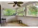 Screened porch with tiled floor and ceiling fan at 1099 4Th Avenue Nw Dr, Hickory, NC 28601
