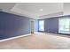 Spacious bedroom with neutral walls and plush carpeting at 116 Hornbeam Ln, Mooresville, NC 28117