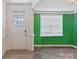 Inviting entryway with green accent wall and hardwood floors at 116 Hornbeam Ln, Mooresville, NC 28117