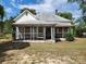 Older fixer-upper home with a screened porch and large yard at 407 Chester Ave, Great Falls, SC 29055
